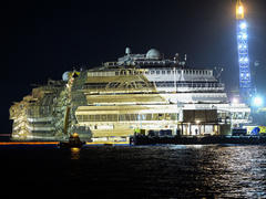 Costa Concordia: Stricken cruise ship hauled upright in Italy